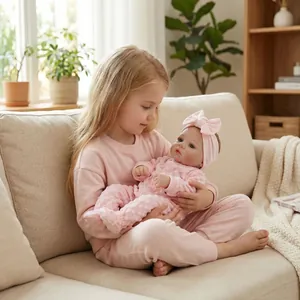 Lifelike 18 inch Meadow reborn baby doll in pink bunny romper held by a girl