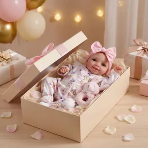 Realistic 17 inch reborn baby doll in pink floral bunny outfit with a headband