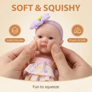 8-inch soft solid silicone reborn baby doll with purple floral headband and pink dress