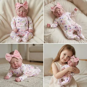Realistic 19-inch reborn baby doll in pink floral rabbit romper and bow headband