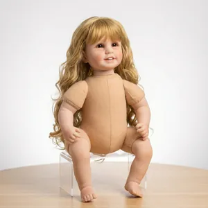 Detailed close-up of a realistic reborn doll with golden curls and soft fabric body