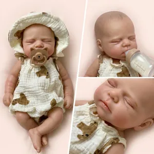 Lifelike 12-inch silicone baby doll in bear romper with matching hat and feeding bottle