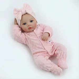 18-inch realistic reborn doll in pink rabbit romper with a matching large bow headband