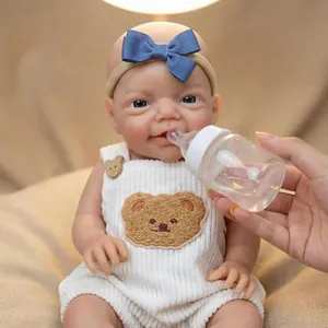 Poupée réaliste de 12 pouces en silicone avec barboteuse ours et bandeau à nœud