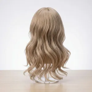 Light brown wavy doll wig displayed on a cylinder stand with soft long curls back view