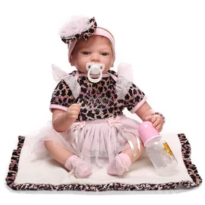 Realistic reborn baby doll with blue eyes in leopard print top and pink tutu skirt