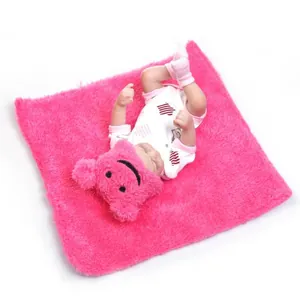 Realistic mini baby doll set with pink bear hat and matching soft plush blanket