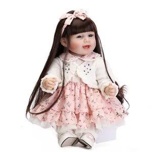 Realistic long-haired princess reborn doll in pink floral dress and white cardigan