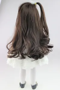 Back view of 18 inch doll featuring long brown wavy hair and white lace floral dress