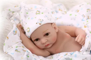 Realistic reborn baby doll in soft vinyl with printed hat and matching swaddle wrap