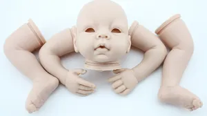Unpainted vinyl reborn baby doll kit parts including head and limbs on white background