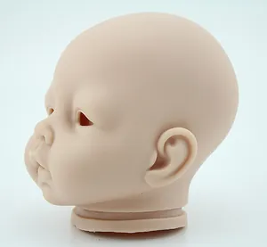 Macro side view of a realistic silicone DIY reborn doll head mold with matte skin texture