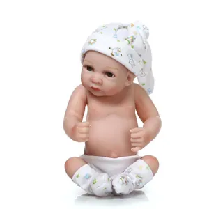 Detail of realistic newborn baby doll with skin texture and cartoon pattern accessories