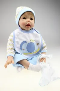 Lifelike reborn baby doll in blue elephant outfit and soft cotton hat with accessories