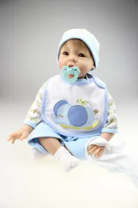 Close-up of realistic silicone baby doll wearing blue elephant outfit with pacifier