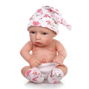 Detailed close-up of a realistic reborn baby doll with lifelike skin texture and soft cotton outfit