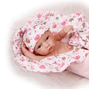 Realistic reborn baby doll with pink elephant pattern hat and soft fleece blanket