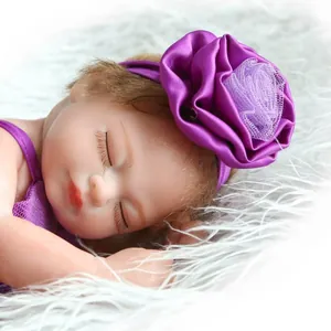 Close-up of baby headband with a large purple satin rose and delicate lace mesh