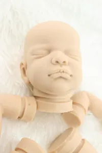 Macro detail of realistic soft silicone reborn baby doll DIY parts on white faux fur