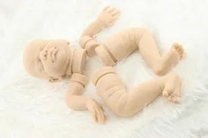 Macro view of soft vinyl reborn doll kit parts showing realistic skin texture and creases