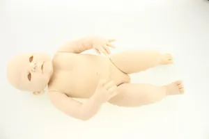Unpainted reborn doll kit featuring lifelike male newborn vinyl body parts on white background