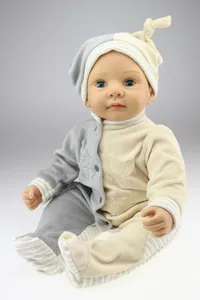 Close-up of realistic reborn doll featuring blue eyes and soft fabric baby clothes