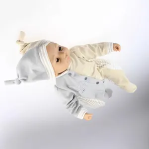 Realistic reborn baby doll in grey velvet onesie with moving eyes and matching infant hat