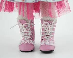 Close-up of pink doll lace-up boots with white lace details and ruffled trim