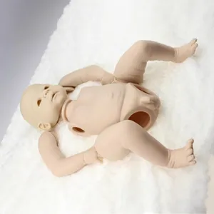 Unpainted soft silicone reborn baby doll kit with realistic skin folds on plush background