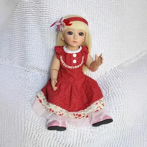 Cute BJD princess doll with blonde hair wearing red polka dot dress on white plush rug