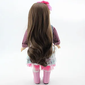 Back view of 18 inch realistic doll with brown curly hair and pink tulle floral dress