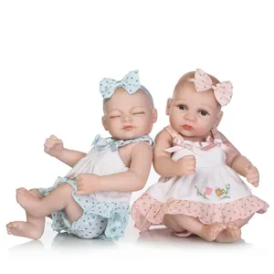 Mini realistic reborn baby dolls set wearing lace floral dresses and matching headbands