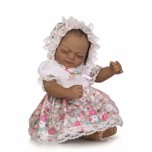 Full body vinyl African American reborn baby doll in floral lace dress and bonnet