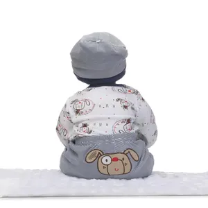 Rear view of cute baby doll outfit featuring striped pants with cartoon dog embroidery