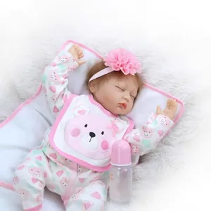 Realistic sleeping baby doll with pink floral headband and accessories on soft plush rug