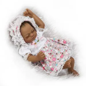 Deep skin tone realistic sleeping baby reborn doll with white lace floral outfit