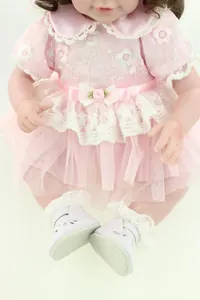 Detail of 20-inch doll outfit with floral embroidery and pink layered mesh skirt