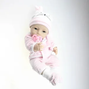Lifelike soft silicone reborn baby doll with pink striped outfit and rabbit hat set
