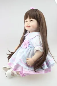 Close-up of lifelike doll featuring brown long hair and pink lace plaid dress details
