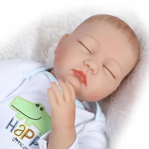 Realistic reborn baby doll in white cartoon romper sleeping on soft white plush background