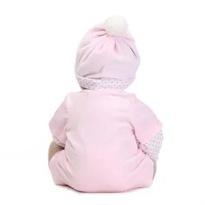 Lifelike reborn baby doll in pink outfit with pom-pom hat, back view on white background