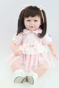 Detailed close-up of 20-inch lifelike reborn baby doll in pink floral lace dress