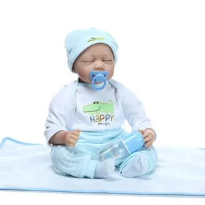 Realistic newborn baby boy doll in blue stripe outfit with pacifier and bottle