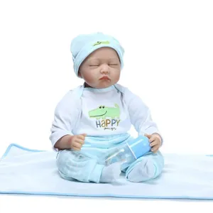 Realistic reborn baby doll in blue striped outfit with hat and bottle accessory
