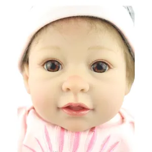 Poupée bébé Reborn réaliste aux yeux marrons et tenue rose pour l'éveil des enfants