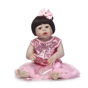 Poupée bébé réaliste en robe à paillettes roses avec biberon et tétine accessoires