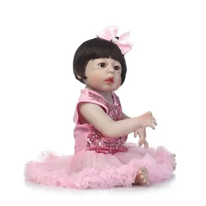 Poupée bébé Reborn réaliste en robe de sequins rose et tulle avec bandeau à nœud