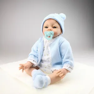 Realistic Reborn Baby Doll Soft Silicone Vinyl And Cotton Body Handmade Lifelike Newborn Girl Toy With Blue Knit Outfit Romper Socks Pacifier