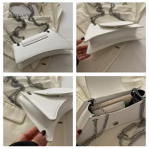 Vistas detalladas del bolso reloj de arena blanco con cadena de plata y espacio