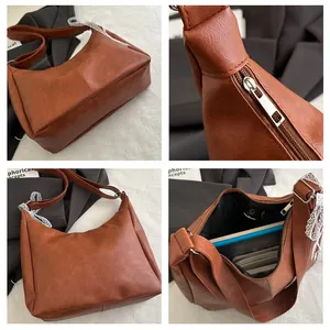Detail view of brown leather tote bag showing internal space and zipper closure